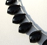 8 inch strand Black Spinel Dolphin Shape Beads