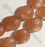 Orange moonstone faceted coin
